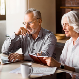 Elderly man and woman planning their trip