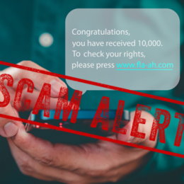Person holding phone with Congratulations text message overlaid with red Scam Alert text