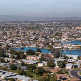 Image shows an aerial view of homes in Sun City, Arizona