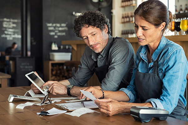 couple checking receipts